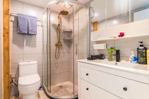 Suite, 2 Bedrooms | Bathroom | Shower, free toiletries, hair dryer, slippers