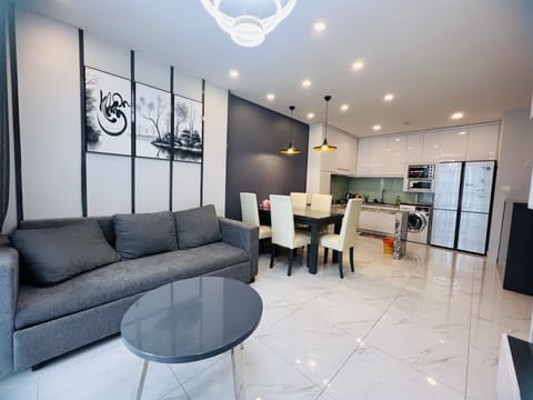 Design Apartment, 3 Bedrooms | Living area | 52-inch flat-screen TV with cable channels, TV