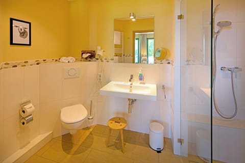 Shower, eco-friendly toiletries, hair dryer, towels