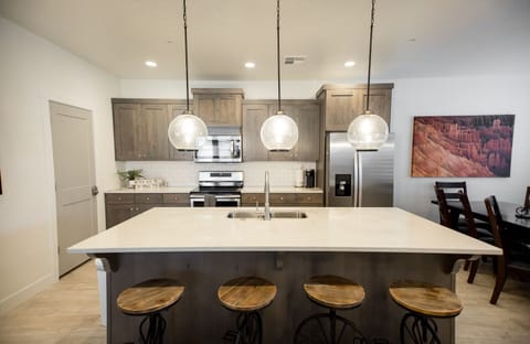 Spacious kitchen and island perfect for prepping family meals or hosting big breakfasts together.