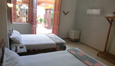 Family Double Room, 2 Double Beds, Accessible, Courtyard View | Egyptian cotton sheets, down comforters, minibar, individually decorated