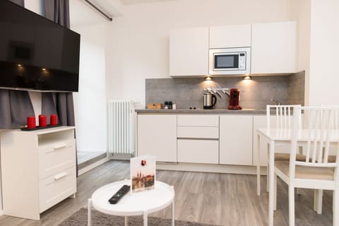 Apartment, Terrace | Private kitchen | Full-size fridge, stovetop, coffee/tea maker, electric kettle