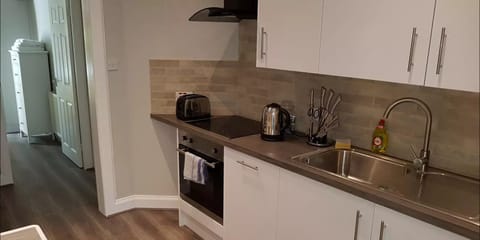 Classic Apartment, 1 King Bed with Sofa bed, Accessible, Garden View | Private kitchen | Full-size fridge, microwave, oven, stovetop