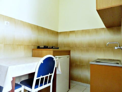 Apartment, Multiple Beds, Balcony | Private kitchenette | Fridge, stovetop, coffee/tea maker, electric kettle