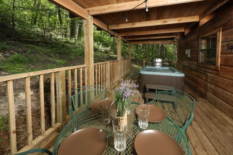 Outdoor eating area is adjacent to hot tub.