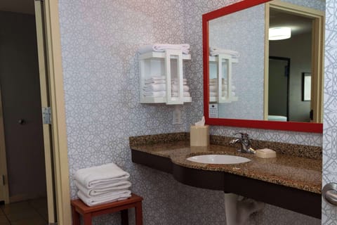 Suite, One King Bed, Accessible | Bathroom | Combined shower/tub, hydromassage showerhead, hair dryer, towels