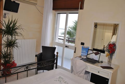 Deluxe Triple Room, Balcony, Sea View | Down comforters, minibar, in-room safe, desk