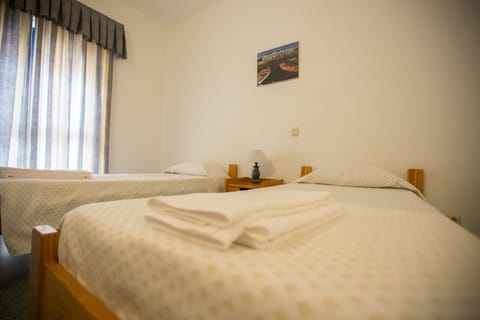 Twin Room, Private Bathroom | Blackout drapes, free WiFi, bed sheets