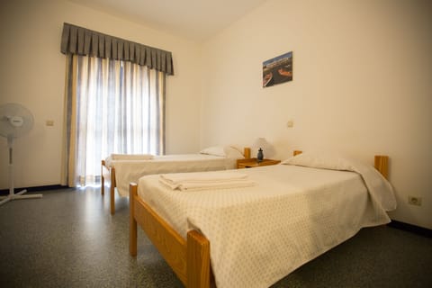 Twin Room, Private Bathroom | Blackout drapes, free WiFi, bed sheets