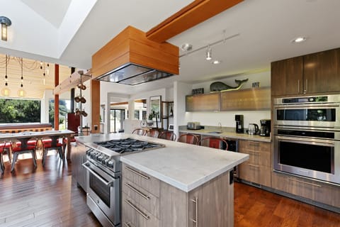 Adjacent to the breakfast/beverage bar is the microwave and electric oven.