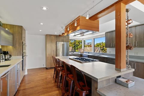 "Gourmet kitchen. Top notch amenities" In Photo: 6 Burner Blue Star Cooking Range with Gas Oven.