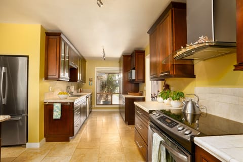 Well stocked chef's kitchen with 2 sinks, 2 dishwashers