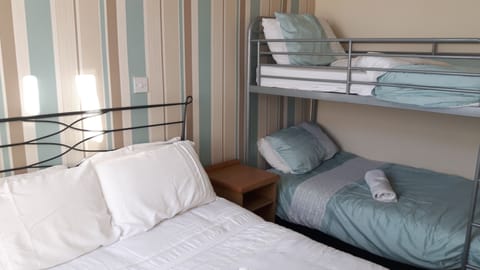 Classic Quadruple Room, Multiple Beds, Non Smoking | Free WiFi, bed sheets