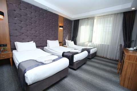 Standard Triple Room | 1 bedroom, memory foam beds, minibar, in-room safe