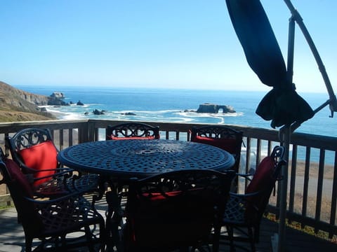 View of Arch Rock taken from front deck and kitchen door. Bar-height seating.