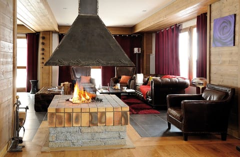 The communal lounge features a fireplace - the perfect spot to warm up after a day on the pistes.