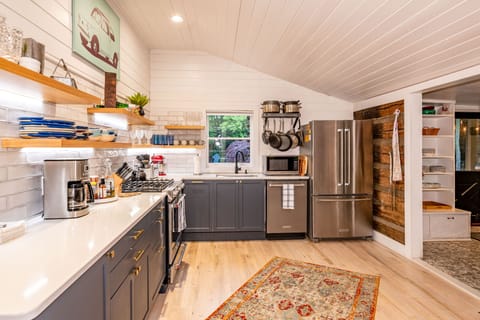 Top end appliances, quartz countertop and professional cooking gear