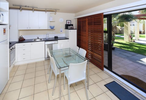 Two Bedroom Apartment with Courtyard | Private kitchen | Fridge, microwave, stovetop, toaster