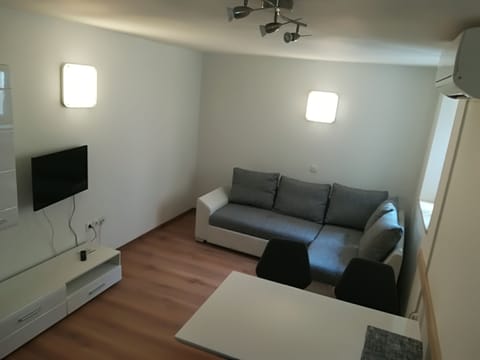 City Apartment, 1 Bedroom | Living area | 52-cm flat-screen TV with cable channels, LCD TV