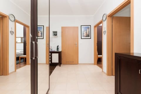 The bright and spacious hallway provides a comfortable space from which doors lead to other rooms.