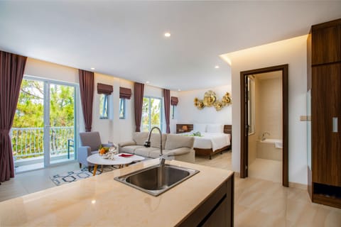 Family Suite | Living area | 45-inch LCD TV with cable channels, TV
