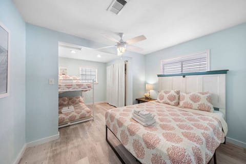 Experience the perfect blend of elegance and practicality in this bedroom with a queen bed and a full bunk bed