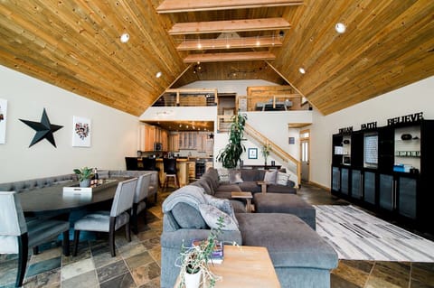 Main floor living, dining and kitchen area facing the lake