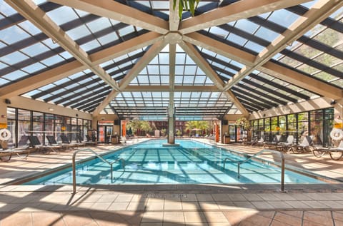 2 indoor pools, outdoor pool, open 8:00 AM to 10:00 PM, pool umbrellas