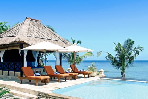 Relax by the Bali Sea or take a dip in the infinity pool.