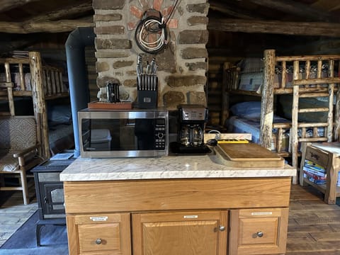 Microwave, coffee maker.
Pots and pans cabinet