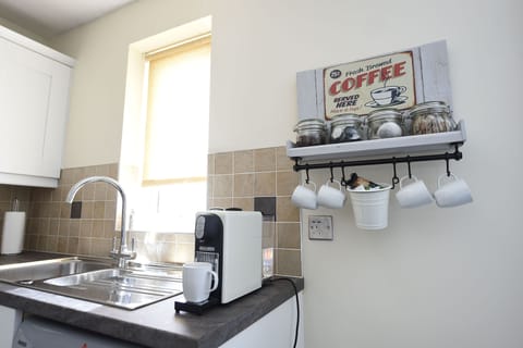 Enjoy a coffee fix with a Nespresso machine. Tea and coffee is provided.