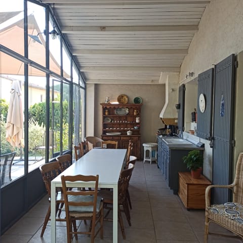 veranda and summer kitchen with glass doors to terrace