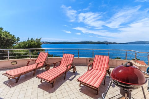 Balcony includes 4 sun loungers and BBQ