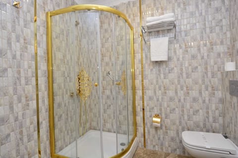 Luxury Suite, Partial Sea View | Bathroom | Combined shower/tub, rainfall showerhead, designer toiletries