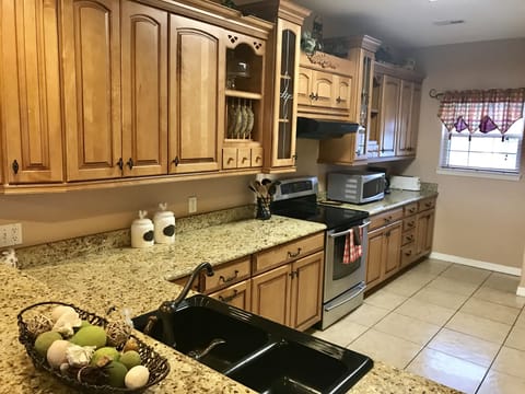 Kraftmaid kitchen with all appliances, electric griddle, crock pot, blender.