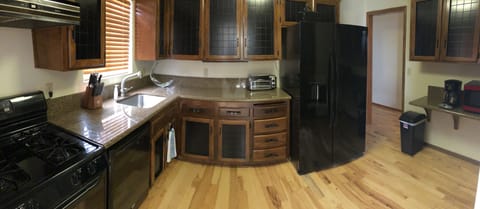 Good sized kitchen fully stocked with spices, pots and pans, dishes, etc