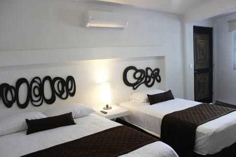 Deluxe Room, Multiple Beds, Non Smoking | In-room safe, free WiFi, bed sheets