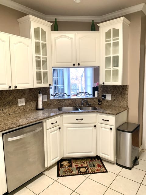 Kitchen with oven, stove, dishwasher, microwave, and refrigerator