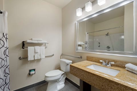 Suite, 1 King Bed, Accessible, Refrigerator & Microwave | Bathroom | Combined shower/tub, free toiletries, hair dryer, towels