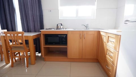 Standard Studio, 2 Twin Beds | Private kitchen | Full-size fridge, microwave, stovetop, toaster