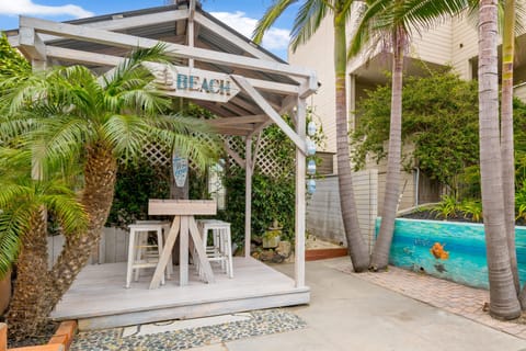 Large Patio with Dining for 8 in the pergola.