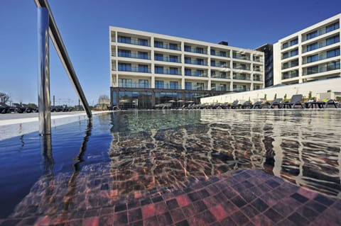 Indoor pool, outdoor pool, pool umbrellas, sun loungers