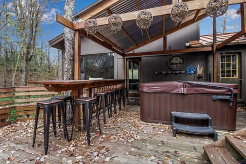 back deck, covered hot tub, bar and floating high table