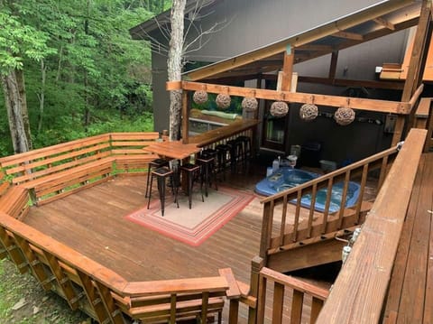 back deck for your fun times, bar, floating high table and surround seating