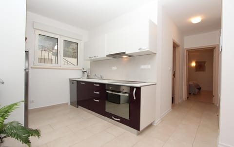 Apartment, 2 Bedrooms | Private kitchen | Fridge, stovetop, coffee/tea maker, electric kettle