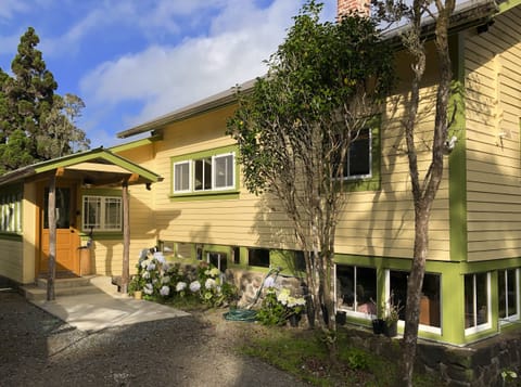 Rear, covered entrance with mud room.