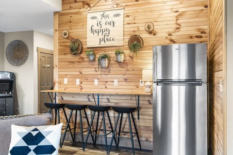 Lower seating area and second refridgerator.