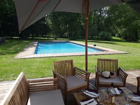 Outdoor pool, a heated pool, sun loungers