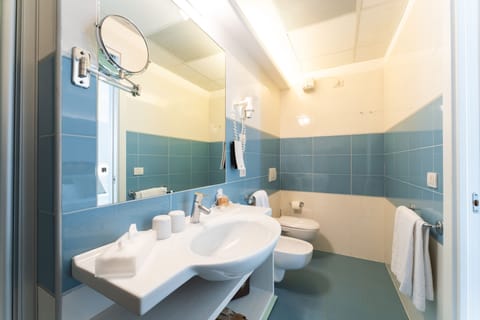 Triple Room, Partial Sea View | Bathroom | Shower, hair dryer, slippers, bidet