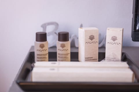 Shower, designer toiletries, hair dryer, slippers